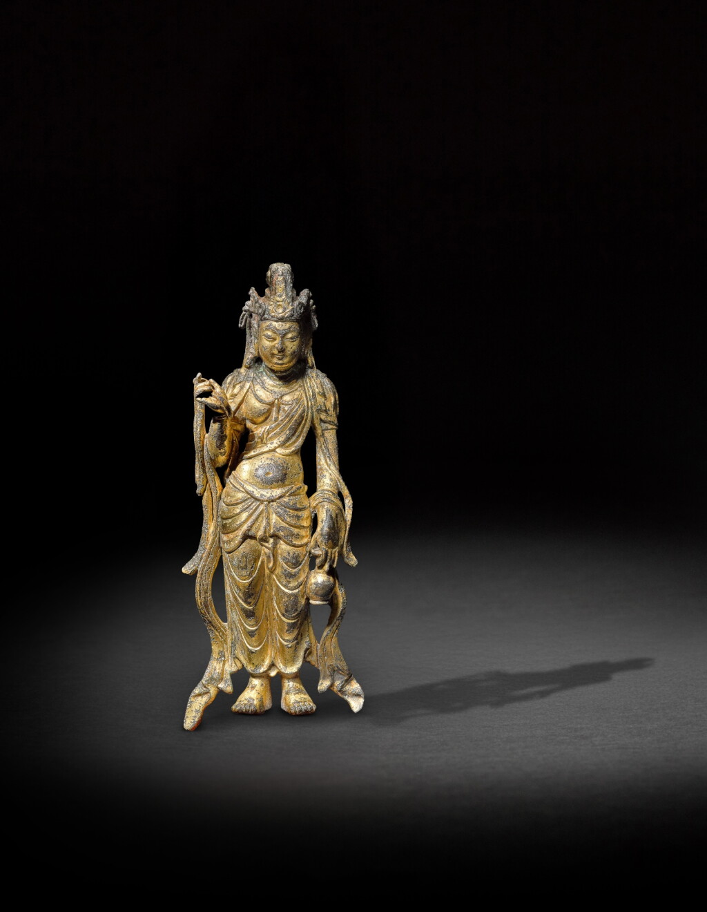 View full screen - View 1 of Lot 110. A gilt-bronze figure of Avalokiteshvara, Tang dynasty .