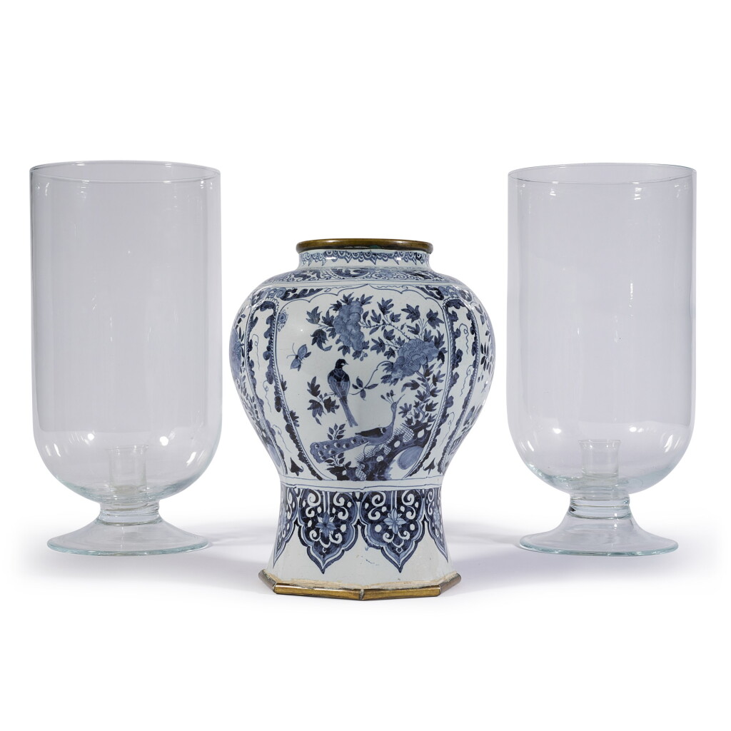 View full screen - View 1 of Lot 91. A Dutch delft baluster vase and a pair of glass hurricane lamps.