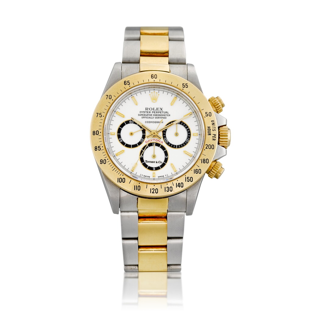 View full screen - View 1 of Lot 2144. Cosmograph Daytona, Reference 16523 | A yellow gold and stainless steel chronograph wristwatch with porcelain dial, suspended logo and bracelet, Retailed by Tiffany & Co., Circa 1988 | 勞力士 | Cosmograph Daytona 型號16520 | 黃金及精鋼計時鏈帶腕錶,備 porcelain 錶盤及懸浮標誌,由 Tiffany & Co. 發行,約1988年製.
