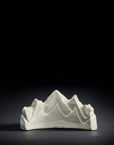 View full screen - View 1 of Lot 9897. A fine and rare white-glazed 'mountain' combined waterpot and brushrest, Late Ming dynasty | 明晚期 白釉五峰水滴兼筆擱.