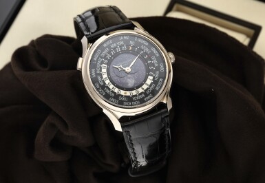 View full screen - View 1 of Lot 61. REFERENCE 5575G-001 A LIMITED EDITION WHITE GOLD WORLDTIME WRISTWATCH WITH MOON PHASES, MADE TO COMMEMORATE THE 175TH ANNIVERSARY OF PATEK PHILIPPE, CIRCA 2015.
