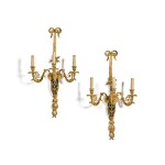 A pair of Louis XVI style gilt-bronze and painted tole three-light wall appliques, late 19th century, after the model by Thomire