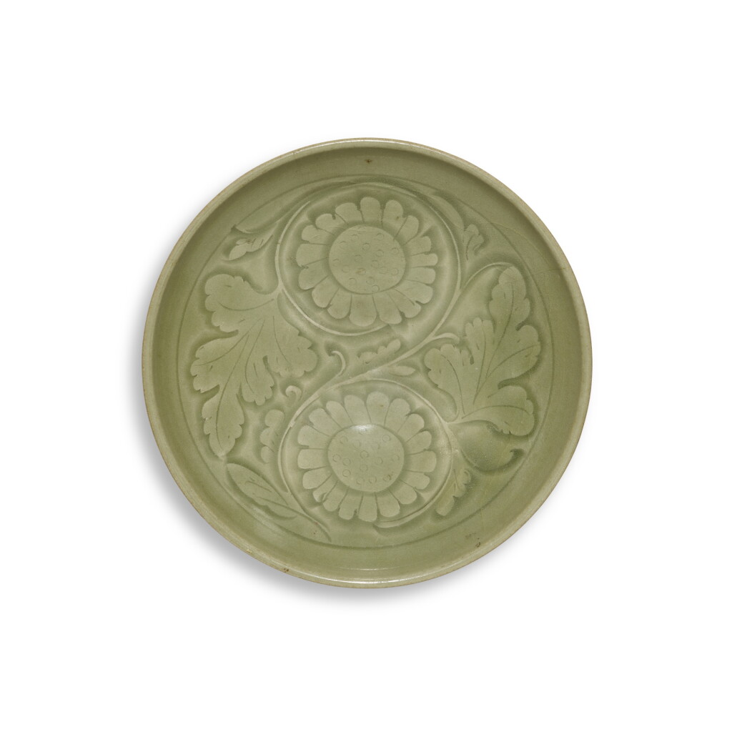 View full screen - View 1 of Lot 50. A carved 'Yaozhou' celadon-glazed 'chrysanthemum' dish, Northern Song / Jin dynasty | 北宋 / 金 耀州窰青釉刻菊紋盤.