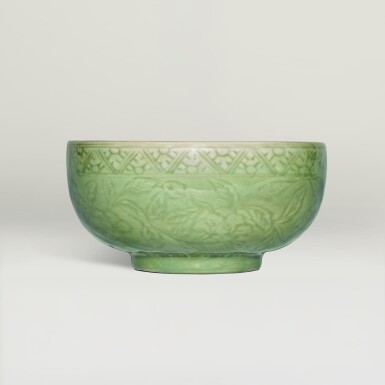 View full screen - View 1 of Lot 129. A superb carved 'Longquan' celadon-glazed 'floral' bowl, Ming dynasty, 15th century .