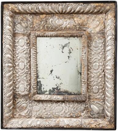 View full screen - View 1 of Lot 127. A silver mirror on wooden core, probably Peru circa 1680 | Miroir en argent sur âme en bois, probablement Pérou vers 1680.