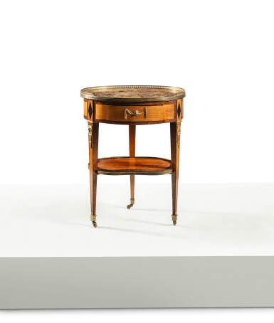 View full screen - View 1 of Lot 172. A North European gilt-bronze mounted lemonwood, amaranth and Rio rosewood veneered occasional table, early 19th century.