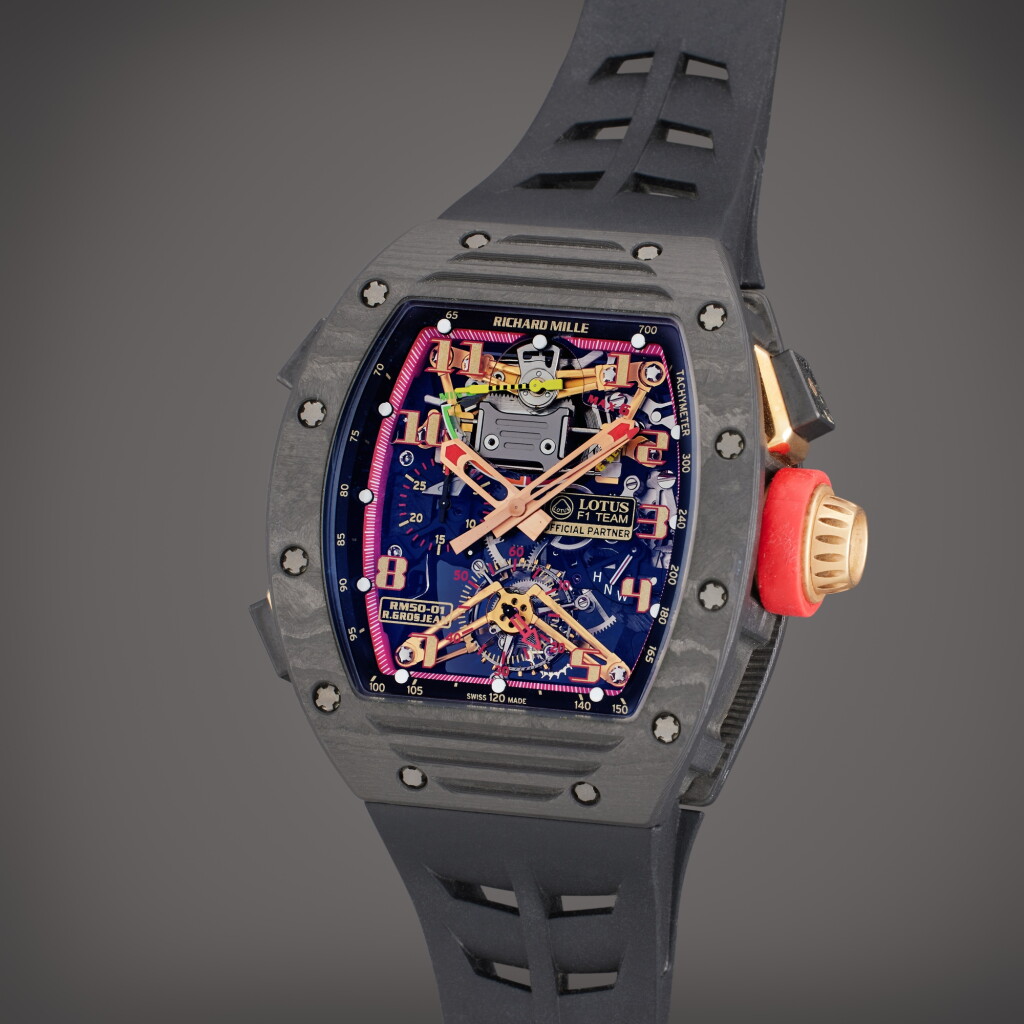 View full screen - View 1 of Lot 374. Reference RM 50-01 'Romain Grosjean Lotus F1 G-Sensor’ | A limited edition carbon NTPT tonneau shaped tourbillon chronograph wristwatch with g-sensor, Previously owned by former Lotus F1 Team Principal Mr. Gerard Lopez, Circa 2015 .
