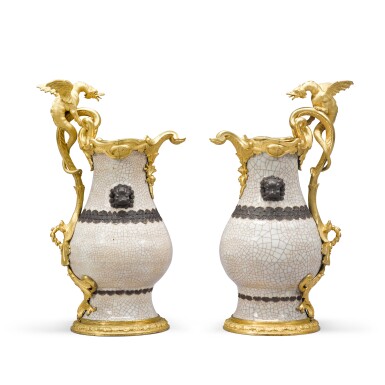 View full screen - View 1 of Lot 28. A pair of gilt-bronze mounted Chinese crackle-glaze celadon porcelain ewers, the porcelain Kangxi period (1662-1722), the mounts Régence/Louis XV, circa 1730-1740.