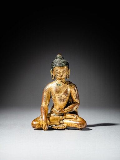 View full screen - View 1 of Lot 149. A gilt-copper seated figure of Shakyamuni Buddha, Nepal, ca. 12th or 13th century | 尼泊爾 約十二或十三世紀 鎏銅合金釋迦摩尼佛坐像.