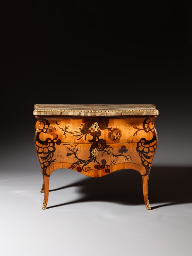 View full screen - View 1 of Lot 48. An Italian amaranth, fruitwood, tulipwood, Rio rosewood and satinwood veneered commode, Roma, circa 1760, most probably by Carlo Palms.