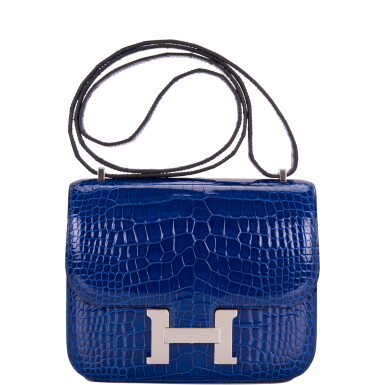 View full screen - View 1 of Lot 12. Hermès Bleu Electrique Mini Constance 18cm of Shiny Mississippiensis Alligator with Palladium Hardware.