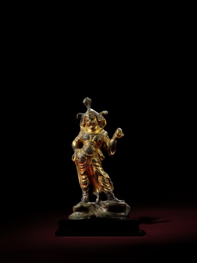 View full screen - View 1 of Lot 333. A small gilt-bronze figure of a guardian, Tang dynasty | 唐 鎏金銅天王立像.