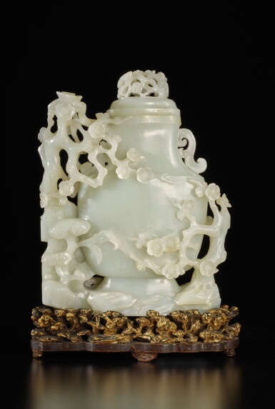 View full screen - View 1 of Lot 522. A large white jade 'prunus and lingzhi' vase and cover, Qing dynasty, Qianlong period | 清乾隆 白玉梅花靈芝紋蓋瓶.