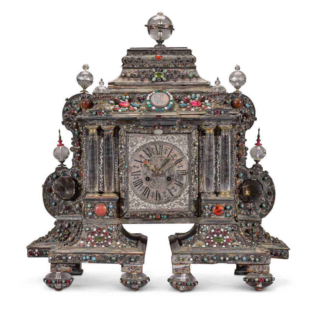 View full screen - View 1 of Lot 47. A turtleshell, silvered and jewelled table clock, probably Austro-Hungarian, early 18th century with a later associated movement and dial.