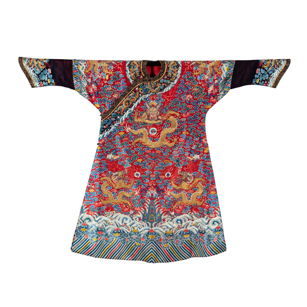 View full screen - View 1 of Lot 121. A red-ground embroidered gauze 'dragon' robe, jifu, Qing dynasty, 18th - 19th century | 清十八至十九世紀 紅地納紗繡金龍雲壽紋吉服袍.