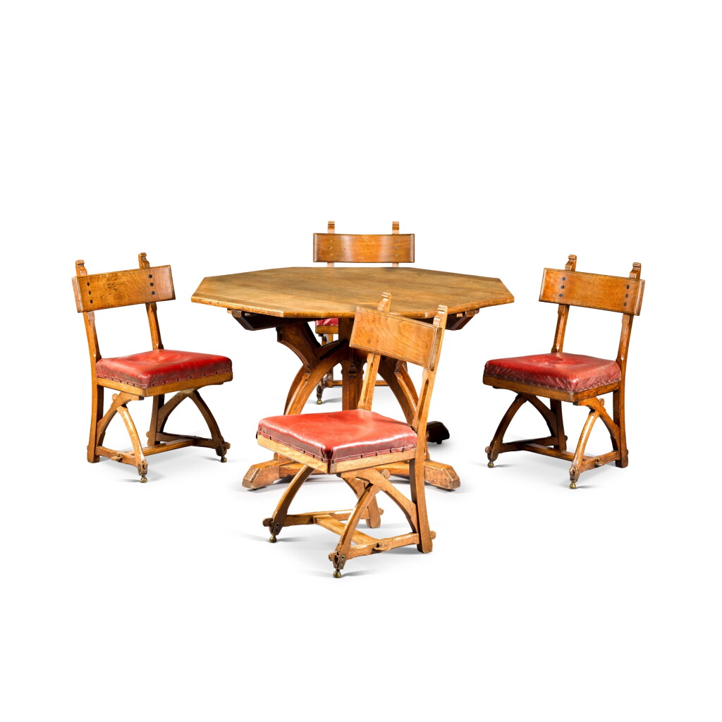 View full screen - View 1 of Lot 239. A Gothic Revival oak table and set of chairs, circa 1870, by Edward Welby Pugin for Gillow & Co.