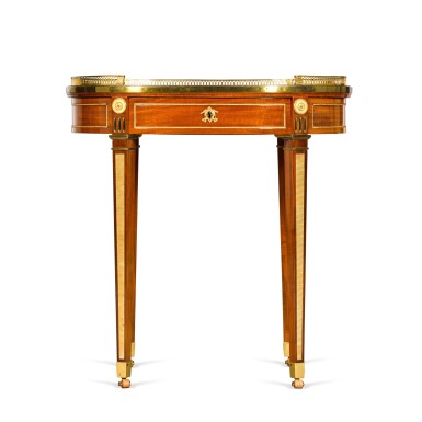 View full screen - View 1 of Lot 126. A German gilt-bronze mounted mahogany writing table, circa 1785-90, attributed to David Roentgen.