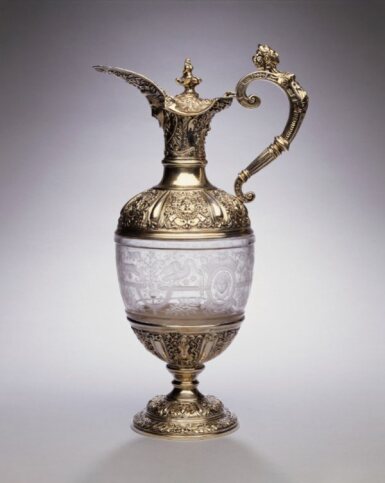 View full screen - View 1 of Lot 329. A Victorian Silver-Mounted Etched Glass "Cellini pattern" Claret Jug, George Fox, London, 1891.