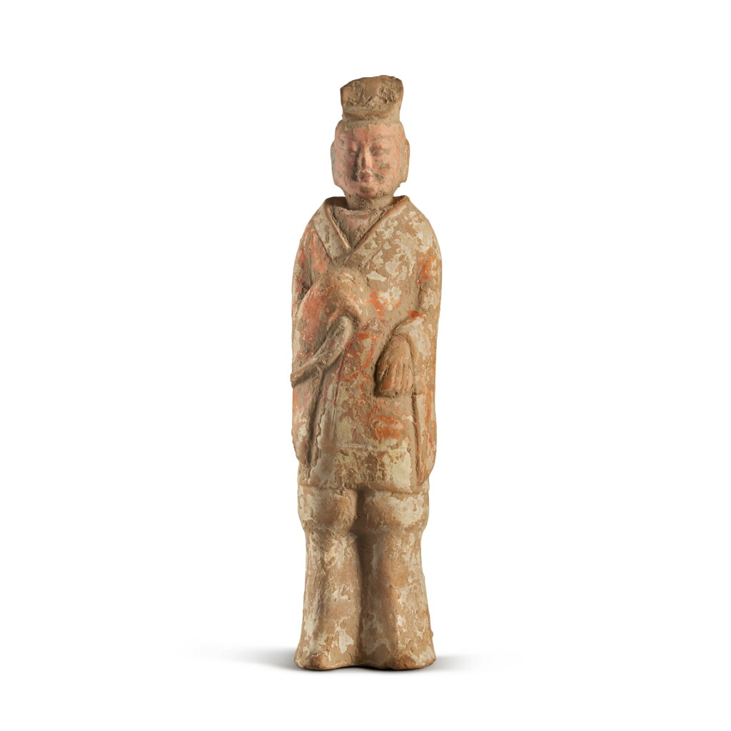 View full screen - View 1 of Lot 667. A painted pottery figure of a standing official, Northern Wei dynasty | 北魏 陶加彩仕人立像.