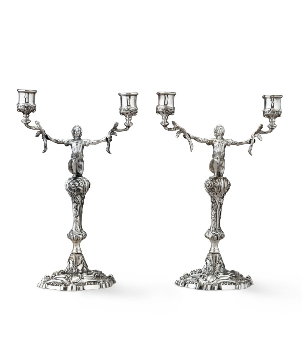 View full screen - View 1 of Lot 118. A pair of Irish silver two-light candelabra with slave motifs, John Letablere, Dublin, 1737-1754 | Paire de chandeliers à 2 lumières à décor d'esclave en argent par John Letablere, Dublin, 1737-1754.