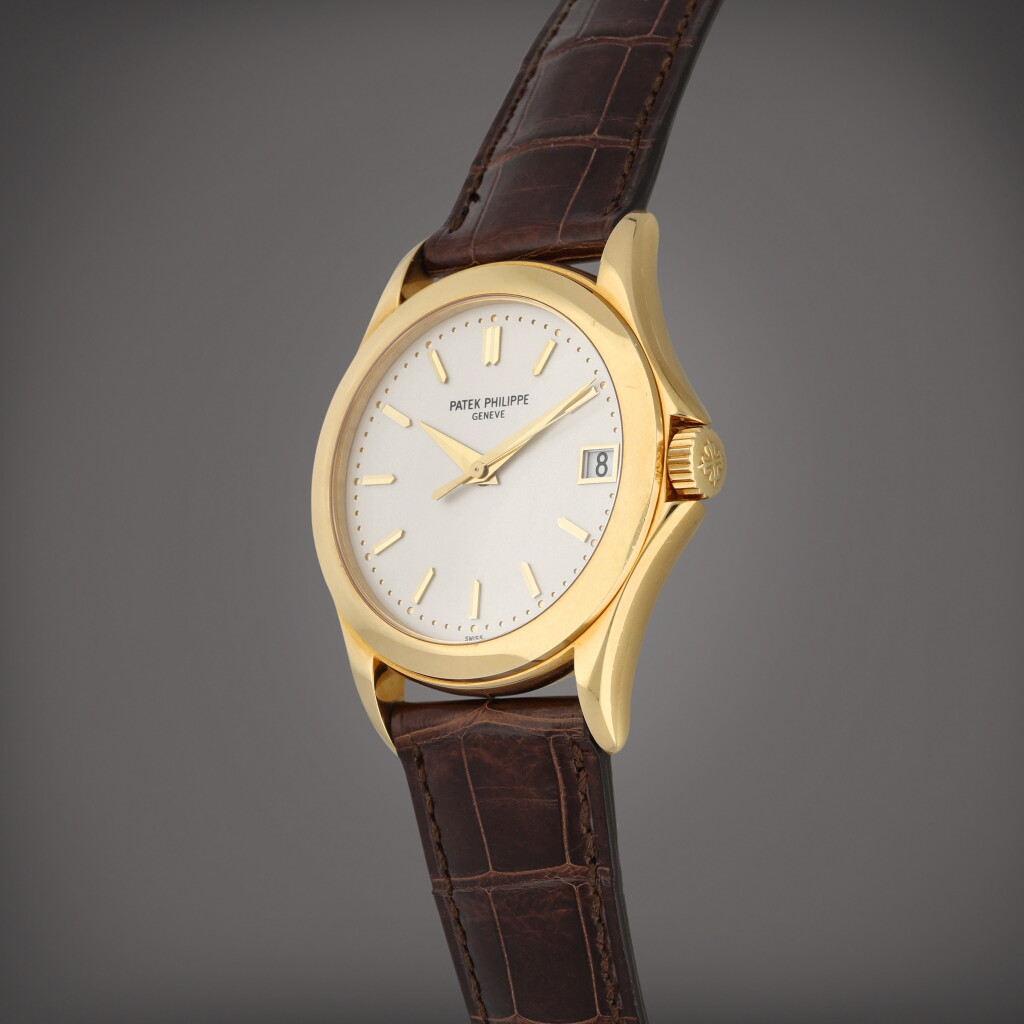 View full screen - View 1 of Lot 34. Calatrava, Reference 5107 | A yellow gold wristwatch with date | Circa 2005.