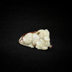 A celadon and russet jade carved of recumbent deer, Late Ming - early Qing dynasty 明末清初 青玉臥鹿