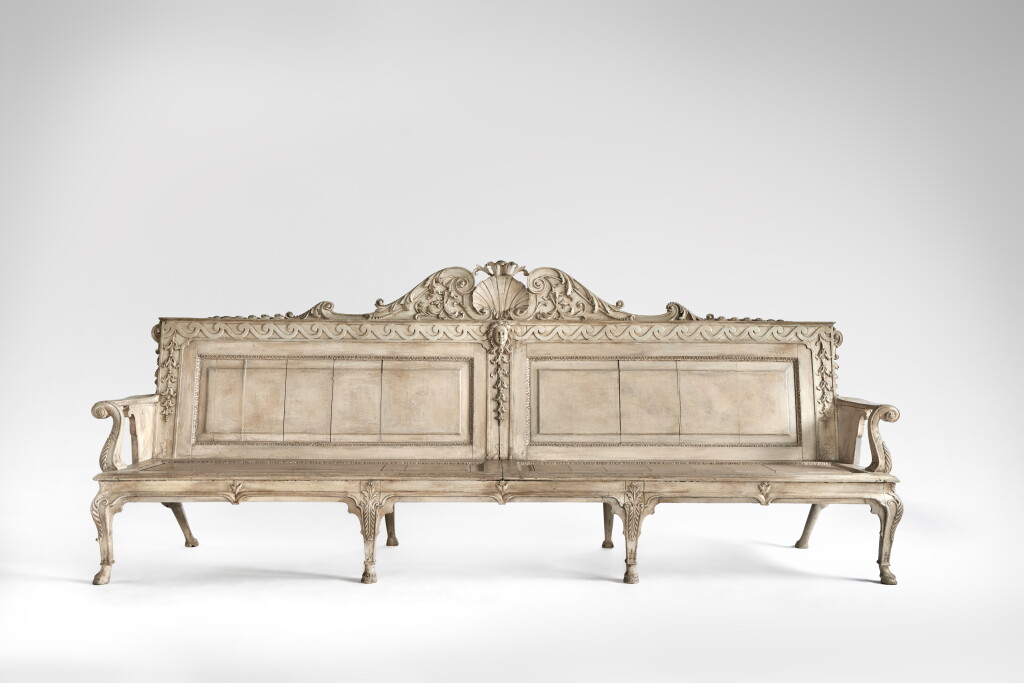 View full screen - View 1 of Lot 11. A George II Gray-Painted Oak Hall Settee in the manner of William Kent, Circa 1740.