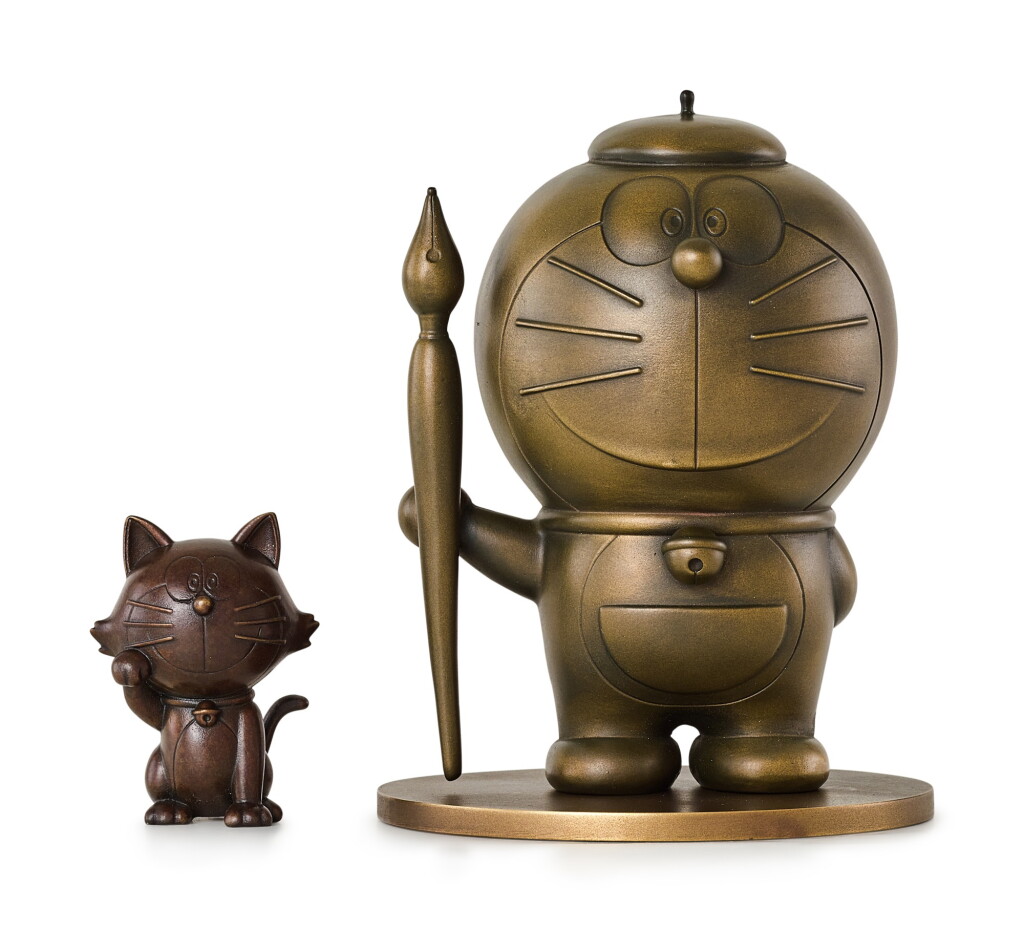 View full screen - View 1 of Lot 15. DORAEMON 多啦A夢 | DORAEMON AND LUCKY CAT SCULPTURE (SET OF TWO) 多啦A夢與招財貓雕塑(一組兩件).