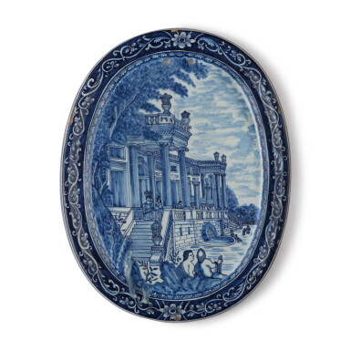 View full screen - View 1 of Lot 543. A DUTCH DELFT BLUE AND WHITE SHAPED OVAL PLAQUE, EARLY 18TH CENTURY.