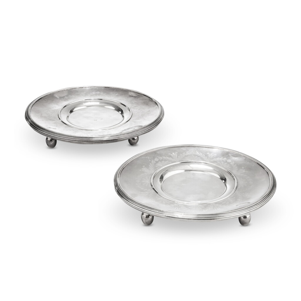 View full screen - View 1 of Lot 1110. A pair of silver sauce-boat stands, Henry Auguste, Paris, 1787-1788 | Paire de supports de saucières en argent par Henry Auguste, Paris, 1787-1788.