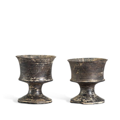 View full screen - View 1 of Lot 820. Two miniature black 'eggshell' pottery stemcups Longshan culture, c. 2500-2000 B.C. 龍山文化 蛋殼黑陶高足盃兩件.