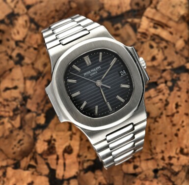 View full screen - View 1 of Lot 74. Reference 3800/001 Nautilus A stainless steel automatic wristwatch with date, bracelet and original cork box, Circa 1983.