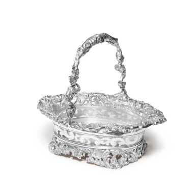 View full screen - View 1 of Lot 129. A George III Silver Large Rococo Revival Cake Basket, Maker's Mark IC Probably for John Clarke II, London, 1808.