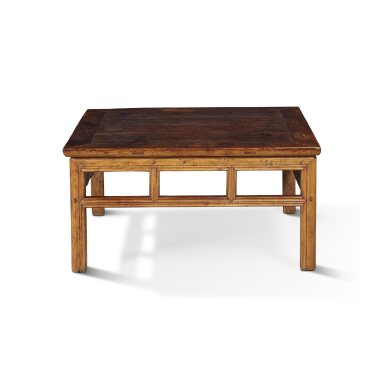View full screen - View 1 of Lot 41. A 'huanghuali' and 'nanmu' low square table, Qing dynasty, 18th century with later modifications.