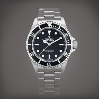 View full screen - View 1 of Lot 375. Submariner, reference 14060M Montre bracelet en acier avec date | Stainless steel wristwatch with date and bracelet Vers 2005 | Circa 2005.