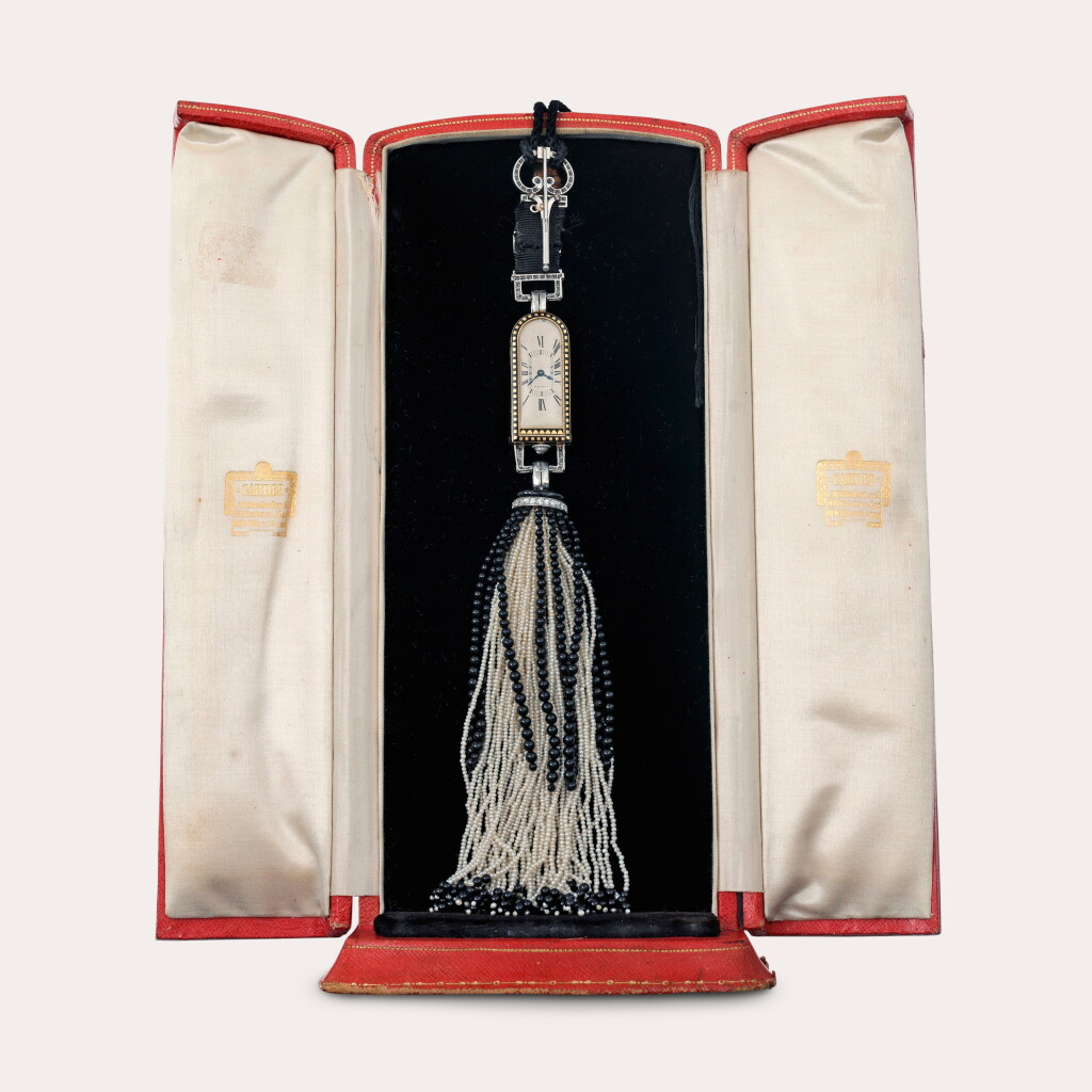 View full screen - View 1 of Lot 56. A gold, platinum, onyx, pearl and diamond-set art deco lady's brooch watch | Circa 1929.