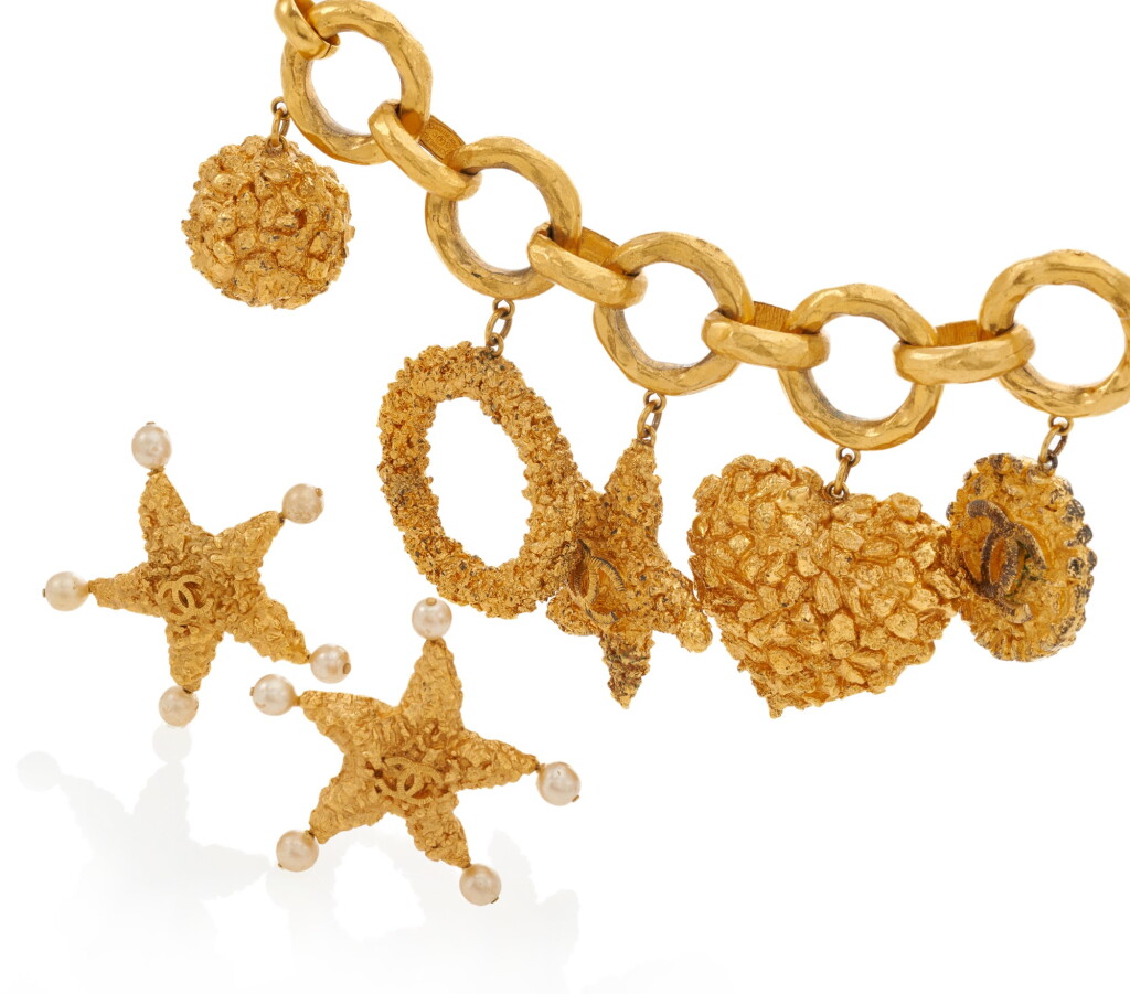 View full screen - View 1 of Lot 176. CHANEL | CHARM BRACELET AND PAIR OF EARCLIPS .