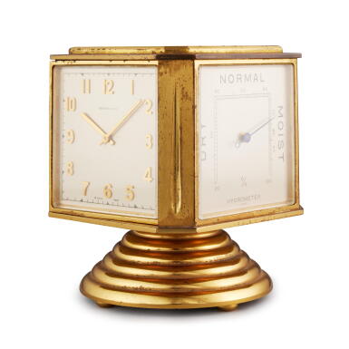 View full screen - View 1 of Lot 90. A gilt brass 8 day desk compendium with thermometer, barometer, and hygrometer, Circa 1950.