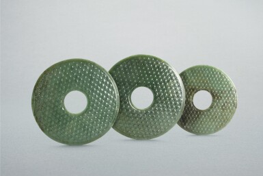 View full screen - View 1 of Lot 755. Three celadon 'grass mat' jade discs, bi, Han dynasty | 西漢 青玉蒲璧 一組三件.