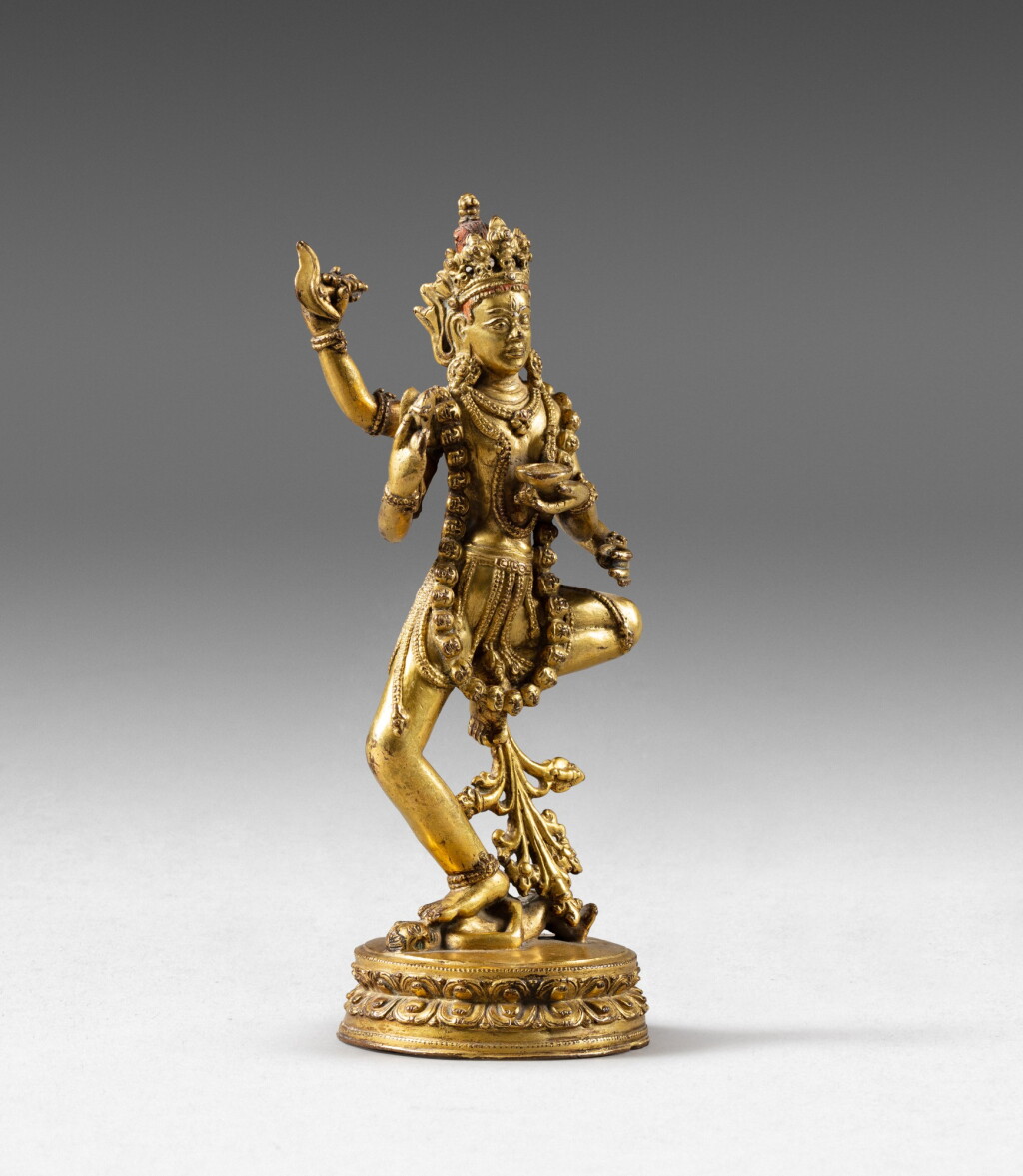 View full screen - View 1 of Lot 121. A gilt copper-alloy figure of Dakini Tibet, 17th century | 西藏 十七世纪 鎏金銅合金空行母立像.