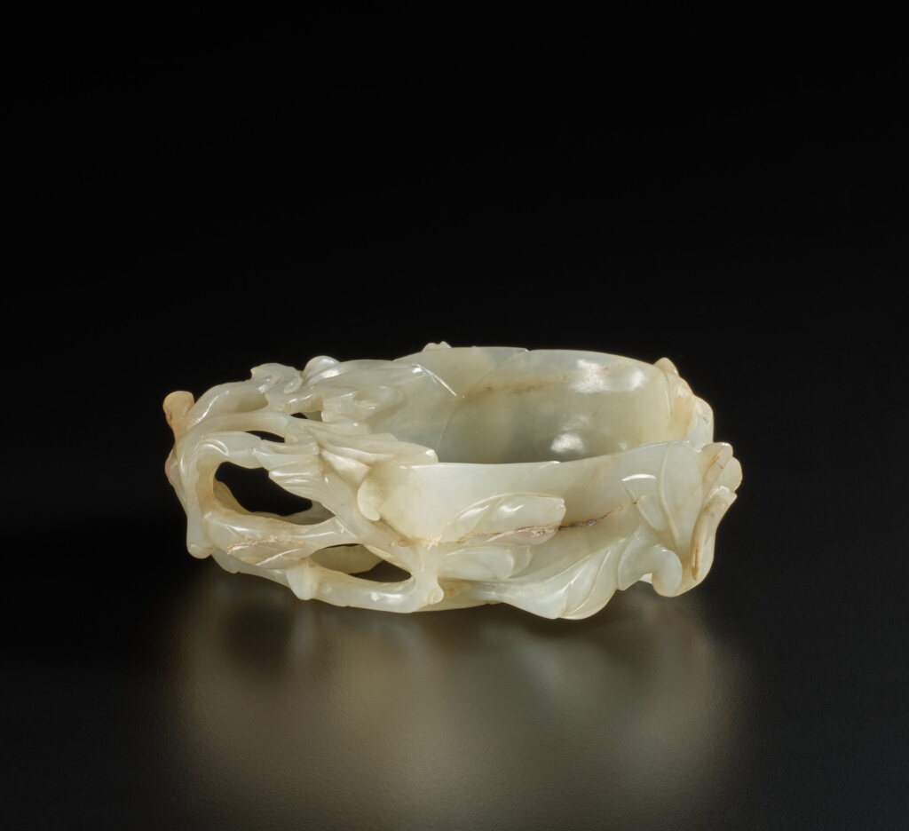 View full screen - View 1 of Lot 274. A celadon jade 'mallow' libation cup, Late Ming dynasty | 明末 青玉鏤雕花式盃.