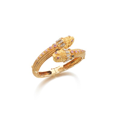 View full screen - View 1 of Lot 805. Gold, pink sapphire, sapphire and diamond bangle.