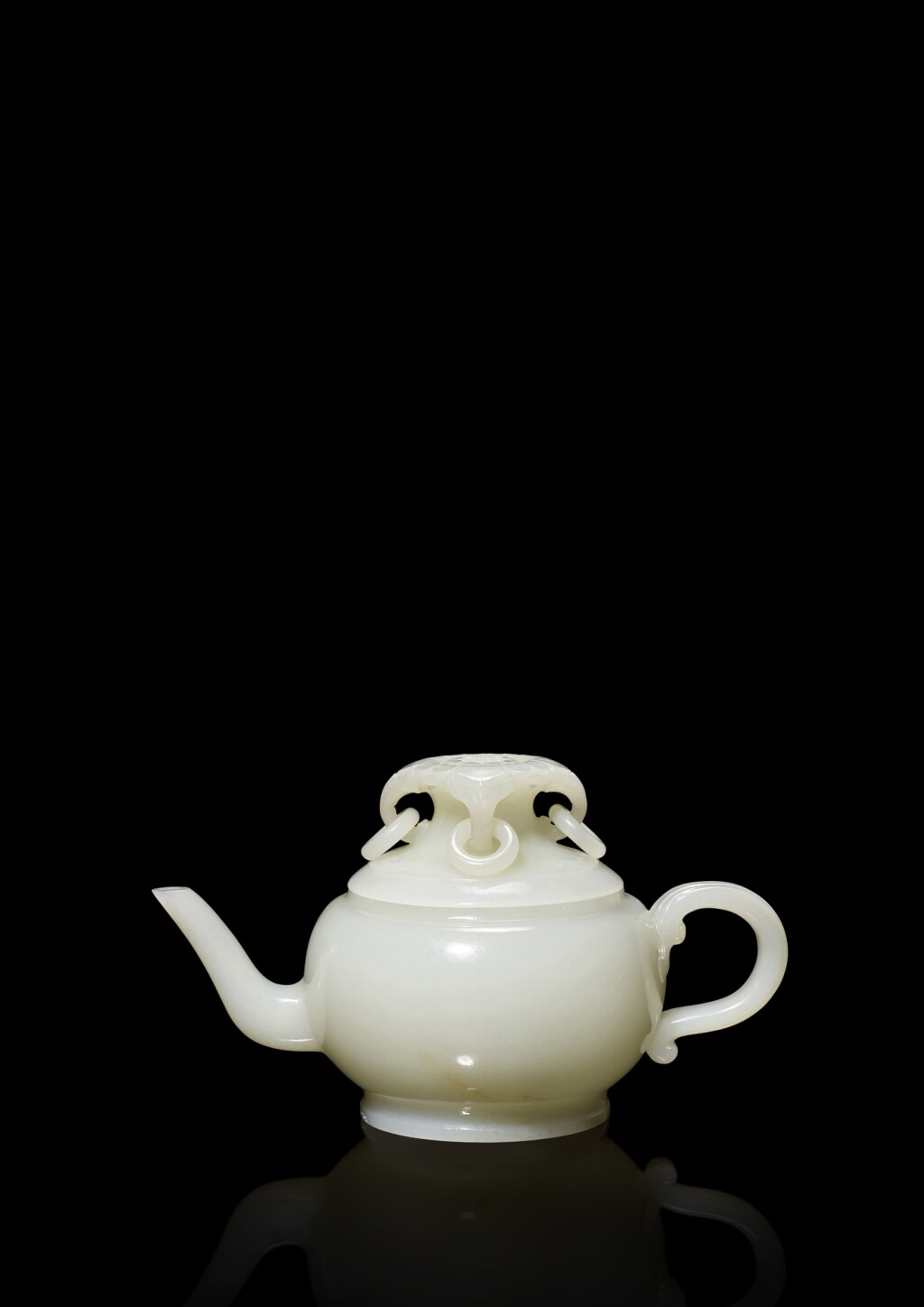 View full screen - View 1 of Lot 3681. An exceptional and finely carved white jade 'floral' teapot and cover, Qing dynasty, Qianlong period | 清乾隆 白玉花鈕夔柄四活環蓋壺.