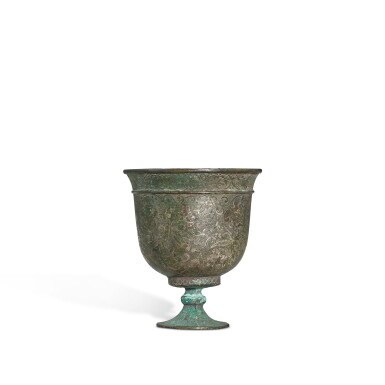 View full screen - View 1 of Lot 3610. A silver 'floral' stem cup, Tang dynasty | 唐 銀鏨花卷草紋高足盃.