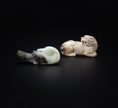 View full screen - View 1 of Lot 91. An archaistic calcified jade mythical beast and a celadon and black jade archaistic phoenix, Qing dynasty | 清 鈣化玉仿古瑞獸把件 及 青灰玉仿古鳳凰把件 一組兩件.