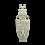 A large white jade archaistic vase and cover, fanglei | 白玉浮雕仿古龍紋瑞獸活環耳蓋壺