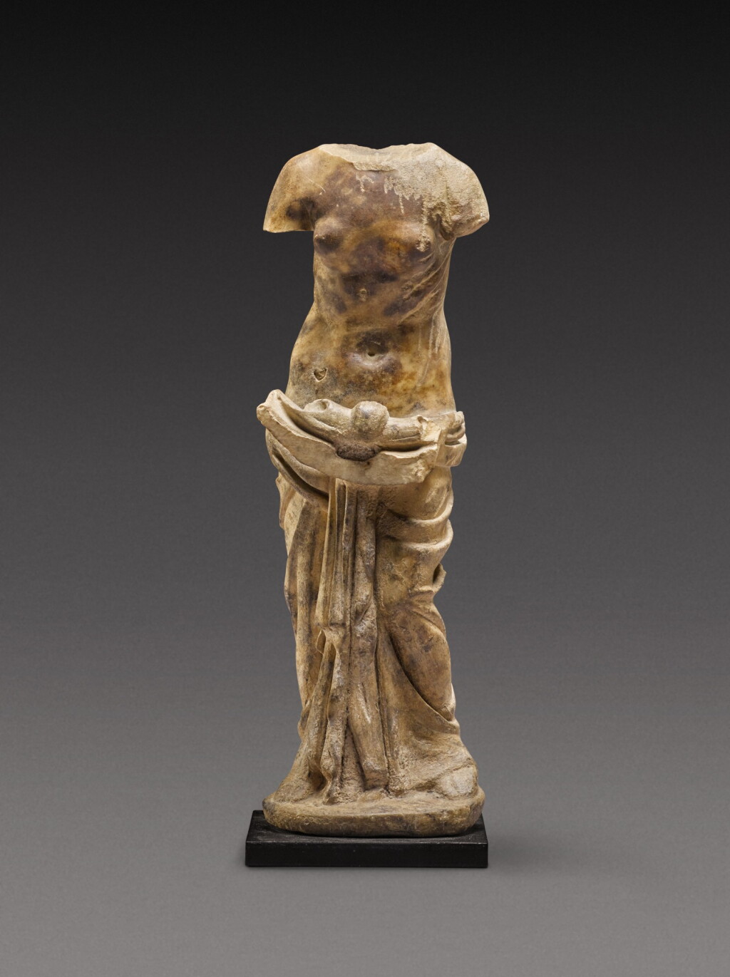 View full screen - View 1 of Lot 83. A Roman Marble Figure of a Nymph holding a Shell , circa 2nd Century A.D..