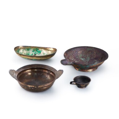 View full screen - View 1 of Lot 1091. Two parcel-gilt silver alloy vessels, a silver alloy oval basin and a parcel-gilt bronze pouring vessel, Tang dynasty | 唐 局部鎏金銀花鳥紋匜及盆、銀合金缽 及 局部鎏金銅花卉紋匜.