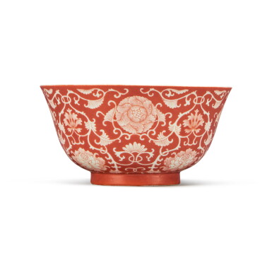 View full screen - View 1 of Lot 533. A fine coral-ground reserve-decorated 'lotus' bowl, Seal mark and period of Daoguang | 清道光 珊瑚紅地留白纏枝蓮紋盌 《大清道光年製》款.