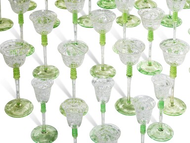 View full screen - View 1 of Lot 437. A Bohemian Green-Tinted and Cut Glass Table Service, Early 20th Century.